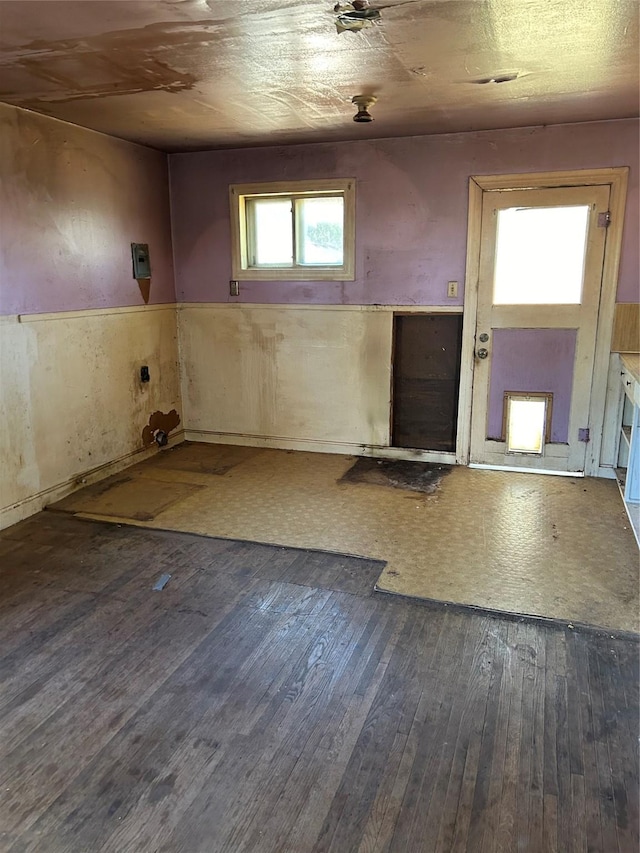 unfurnished room with wood-type flooring