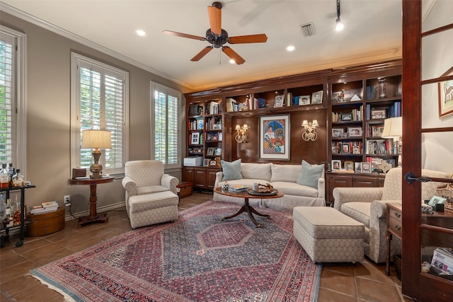 living area with crown molding, tile patterned floors, and ceiling fan