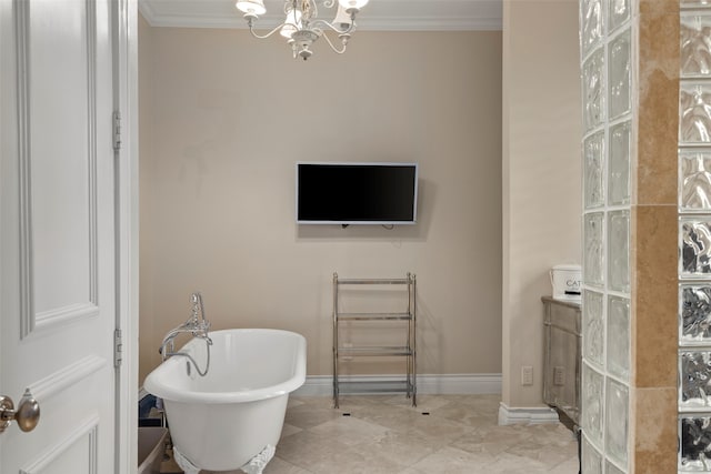 bathroom with tile patterned flooring, ornamental molding, a chandelier, and a washtub