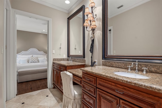 bathroom featuring vanity, ornamental molding, and hardwood / wood-style flooring