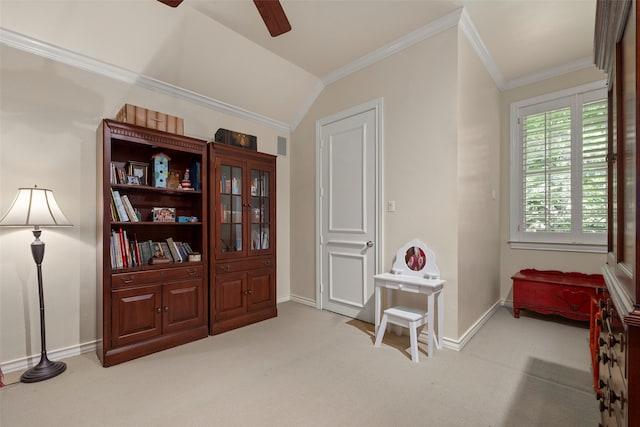 interior space with light carpet, lofted ceiling, ceiling fan, and crown molding