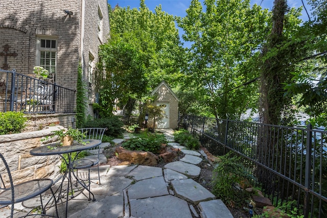 view of patio with a shed