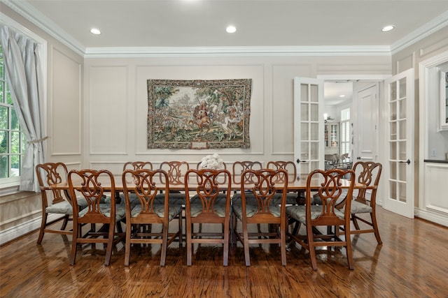 dining space featuring ornamental molding, french doors, and dark hardwood / wood-style floors