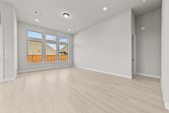 spare room featuring light hardwood / wood-style flooring