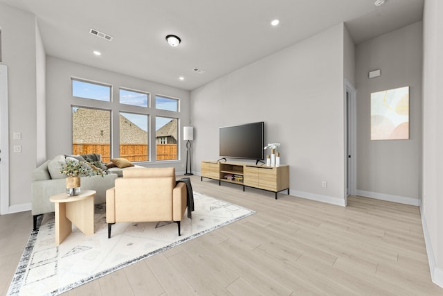 living room with light hardwood / wood-style flooring