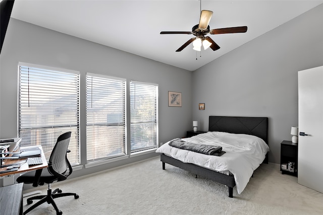 carpeted bedroom with lofted ceiling and ceiling fan