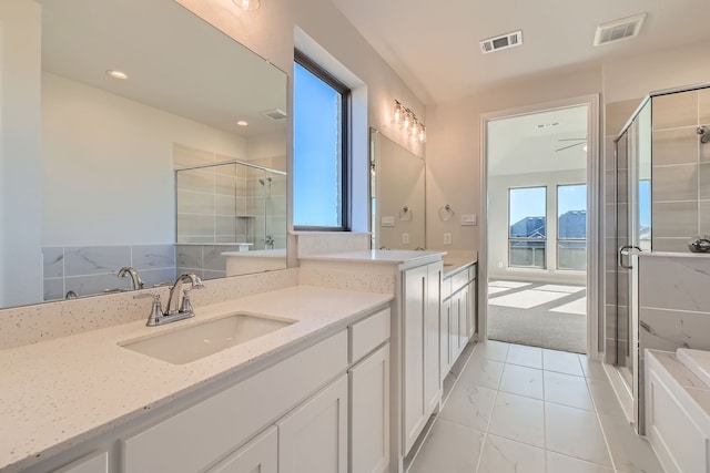 bathroom with vanity and walk in shower