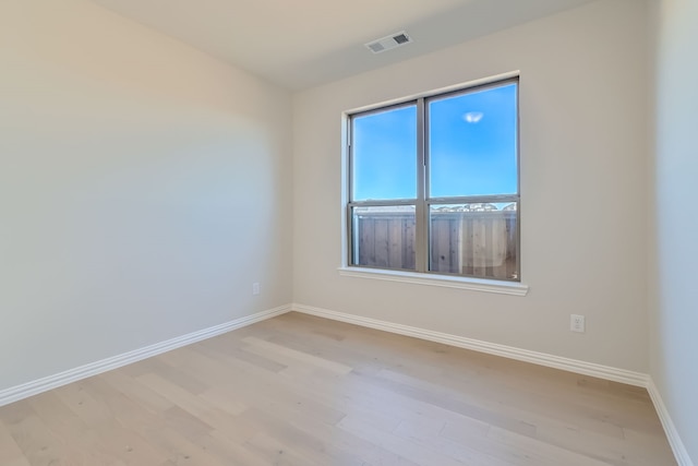 spare room featuring light hardwood / wood-style flooring