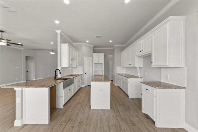 kitchen with kitchen peninsula and white cabinets