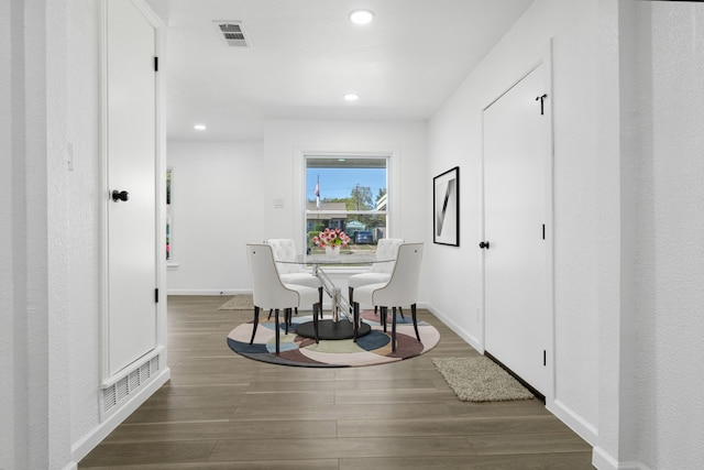 dining area with dark hardwood / wood-style flooring