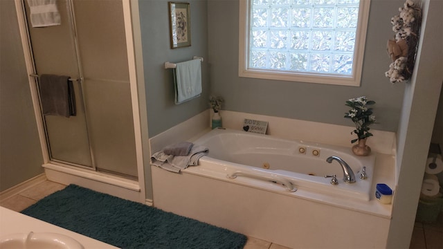 bathroom featuring tile patterned flooring, separate shower and tub, and vanity