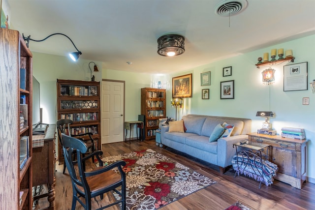 living room with dark hardwood / wood-style floors