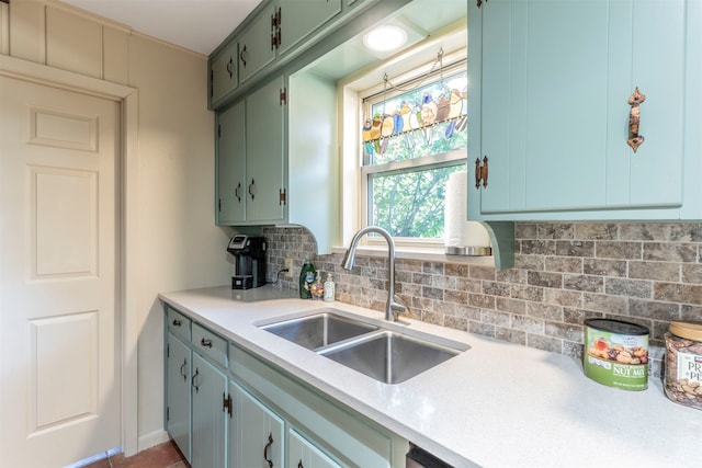 kitchen featuring tasteful backsplash and sink