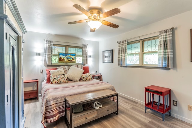 bedroom featuring wood-type flooring and ceiling fan