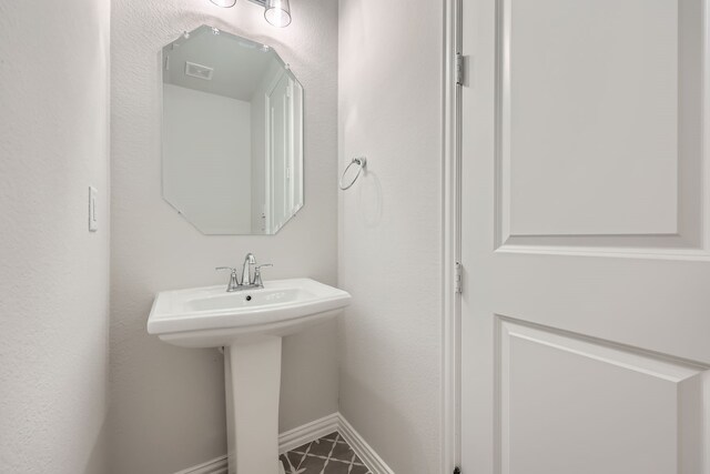 bathroom with sink and tile patterned floors