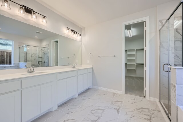 bathroom with vanity and an enclosed shower