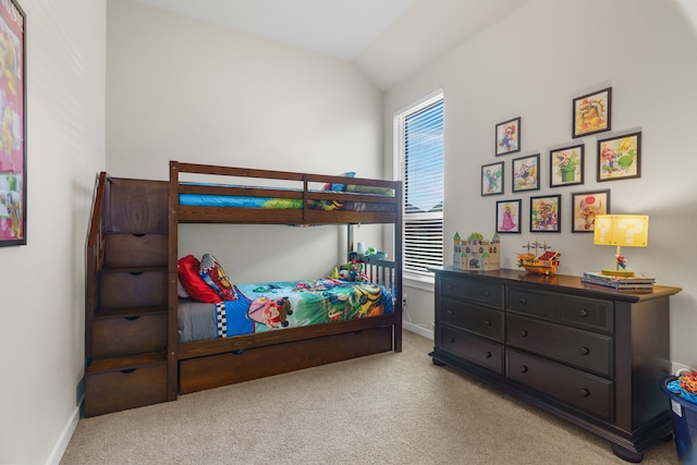 carpeted bedroom with vaulted ceiling