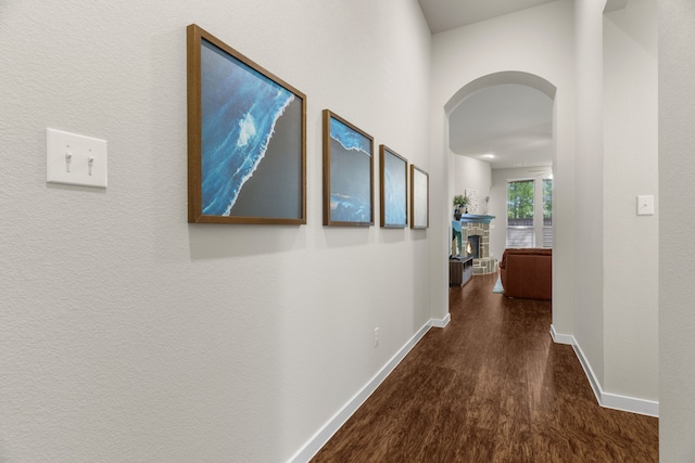 hall with dark hardwood / wood-style floors