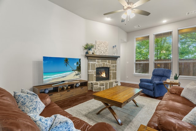 living room with a fireplace, hardwood / wood-style floors, and ceiling fan