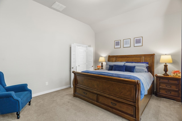 carpeted bedroom featuring lofted ceiling