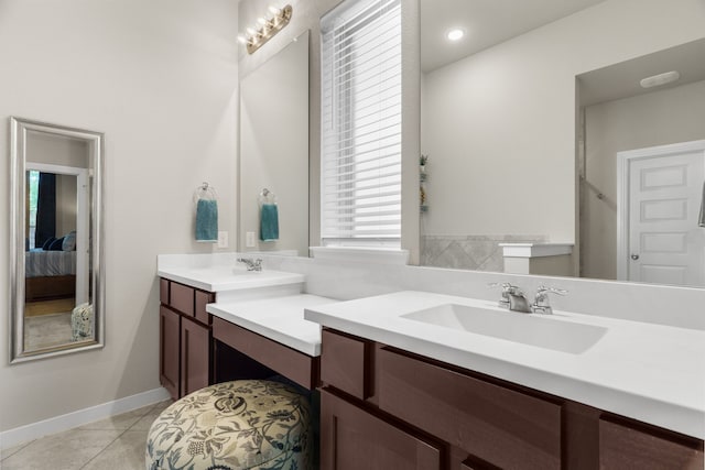 bathroom with tile patterned flooring and vanity