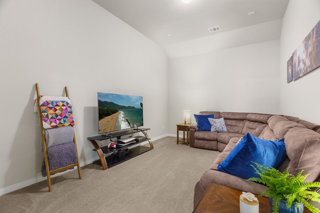 carpeted living room with lofted ceiling