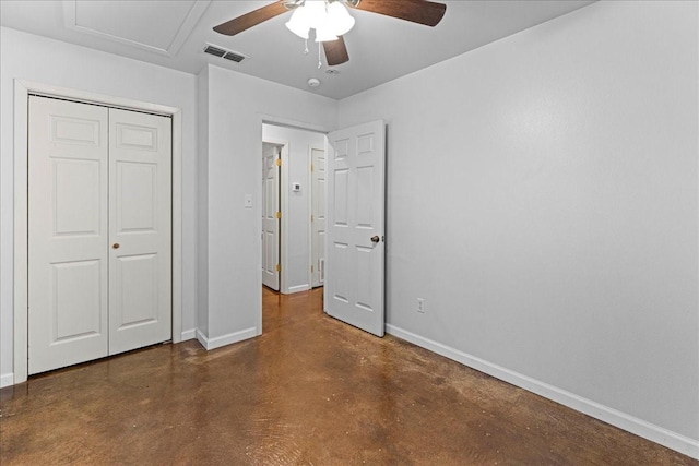 unfurnished bedroom featuring baseboards, a closet, visible vents, and finished concrete floors