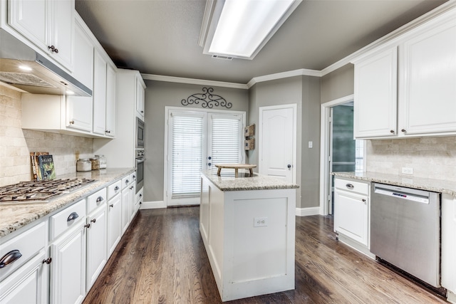 kitchen with white cabinetry, appliances with stainless steel finishes, and dark hardwood / wood-style floors