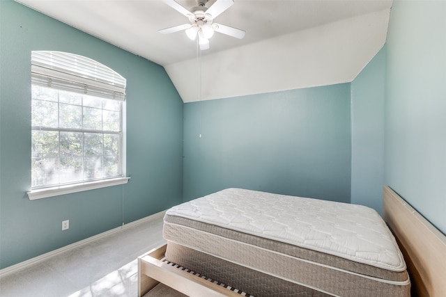 carpeted bedroom featuring ceiling fan and vaulted ceiling