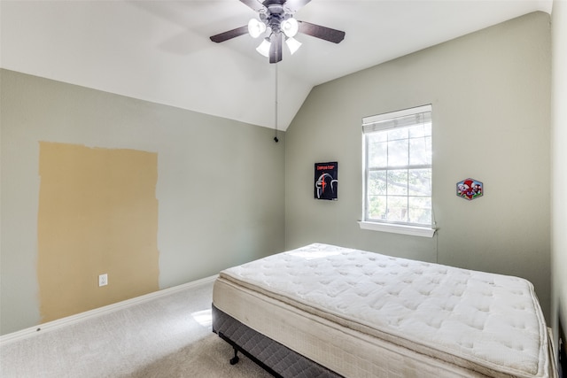 bedroom featuring vaulted ceiling, carpet flooring, and ceiling fan