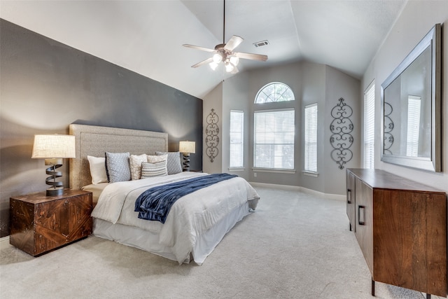 carpeted bedroom with lofted ceiling and ceiling fan