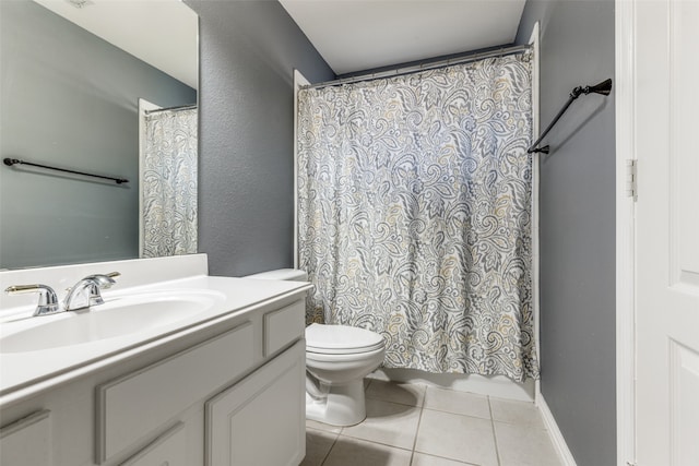 bathroom with vanity, curtained shower, toilet, and tile patterned floors