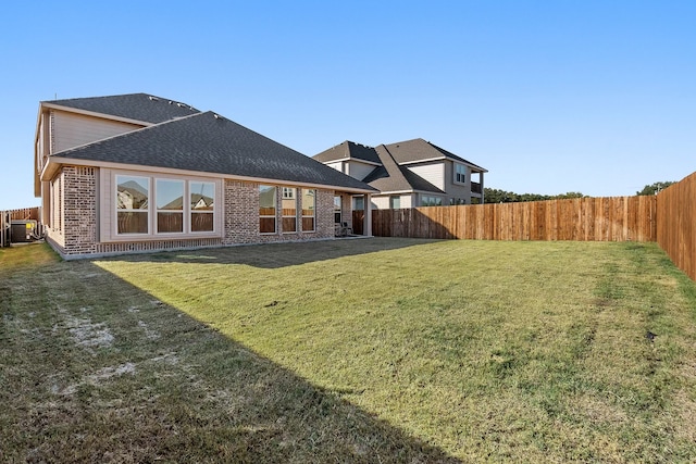 back of house with a yard, cooling unit, and a patio