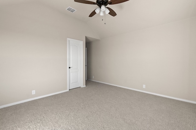 spare room with vaulted ceiling, carpet floors, and ceiling fan