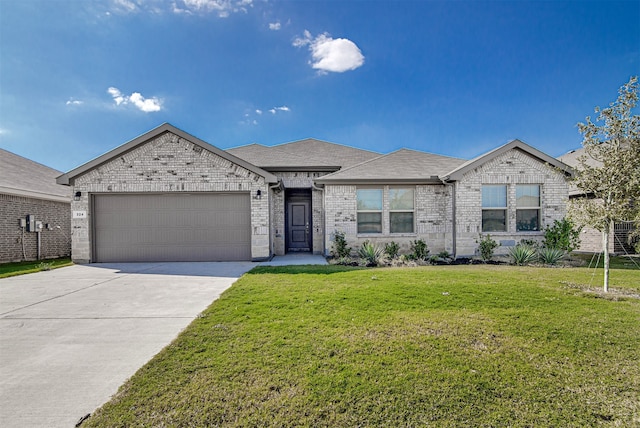 view of front of house with a front yard and a garage