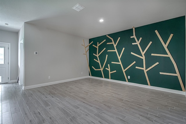 spare room featuring hardwood / wood-style flooring