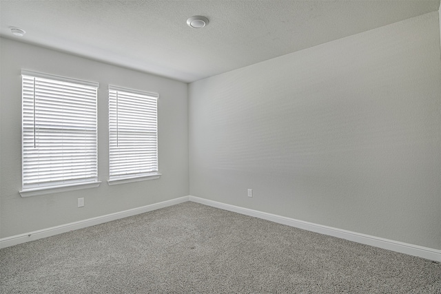 unfurnished room with carpet floors