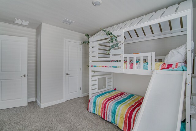 bedroom featuring light carpet