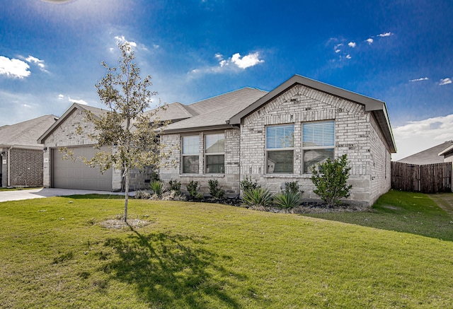 view of front of property featuring a front lawn and a garage