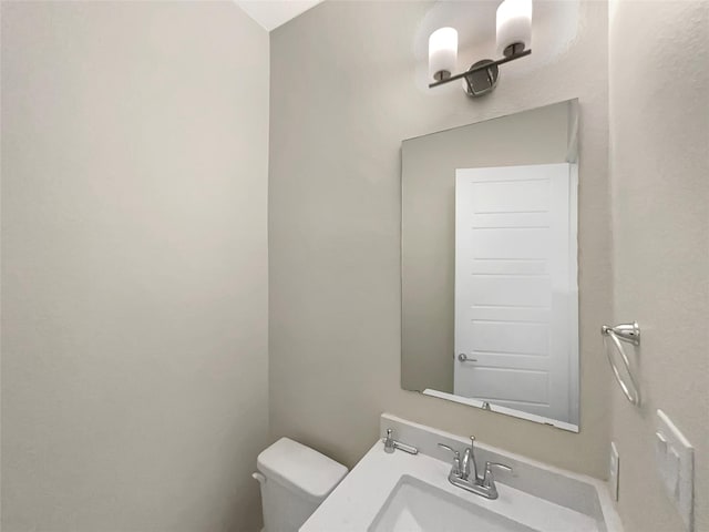 bathroom with toilet and a sink