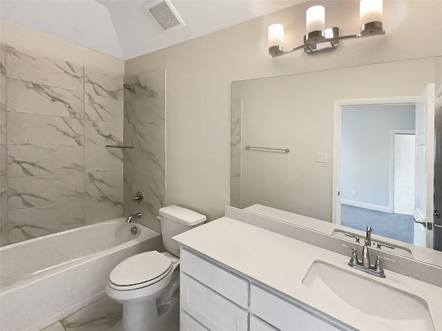 full bathroom with vanity, toilet, and tiled shower / bath