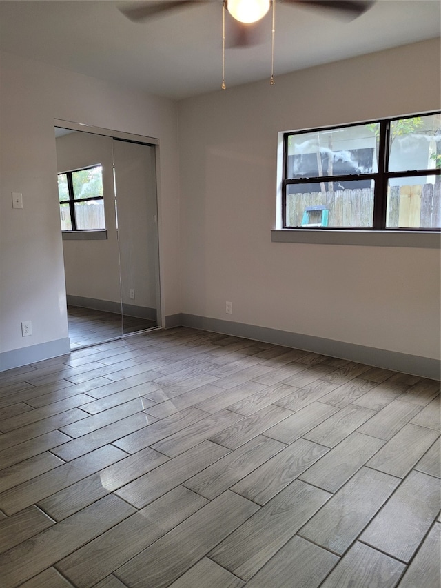 unfurnished room with light hardwood / wood-style floors and ceiling fan