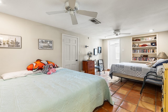 bedroom featuring tile patterned flooring and ceiling fan