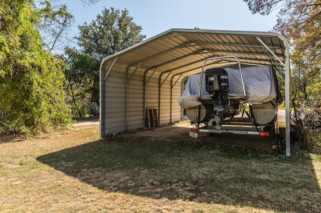 view of parking / parking lot featuring a yard and a carport