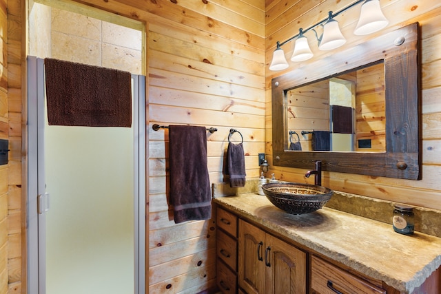 bathroom featuring vanity and wooden walls