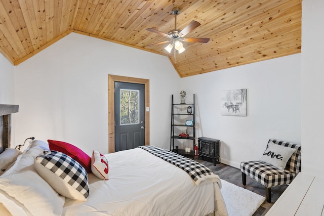 bedroom featuring lofted ceiling, wooden ceiling, and ceiling fan