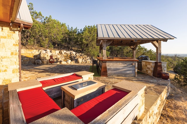 view of patio / terrace with a gazebo and an outdoor living space with a fire pit