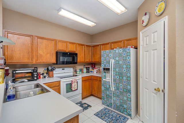 kitchen with light tile patterned floors, sink, white range with electric cooktop, and refrigerator with ice dispenser