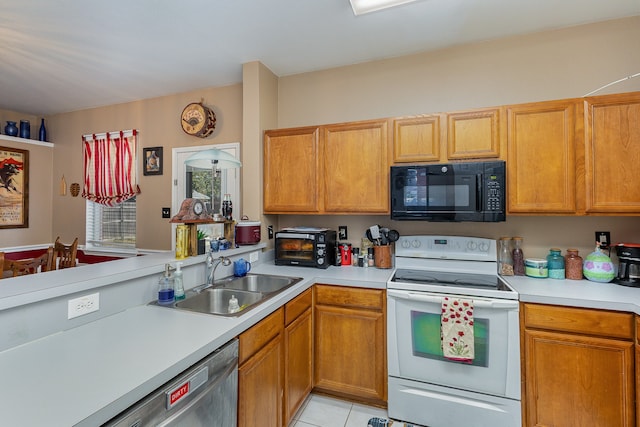 kitchen featuring stainless steel dishwasher, white electric range oven, sink, and light tile patterned floors