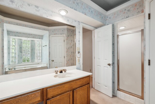 bathroom with vanity, crown molding, and shower with separate bathtub